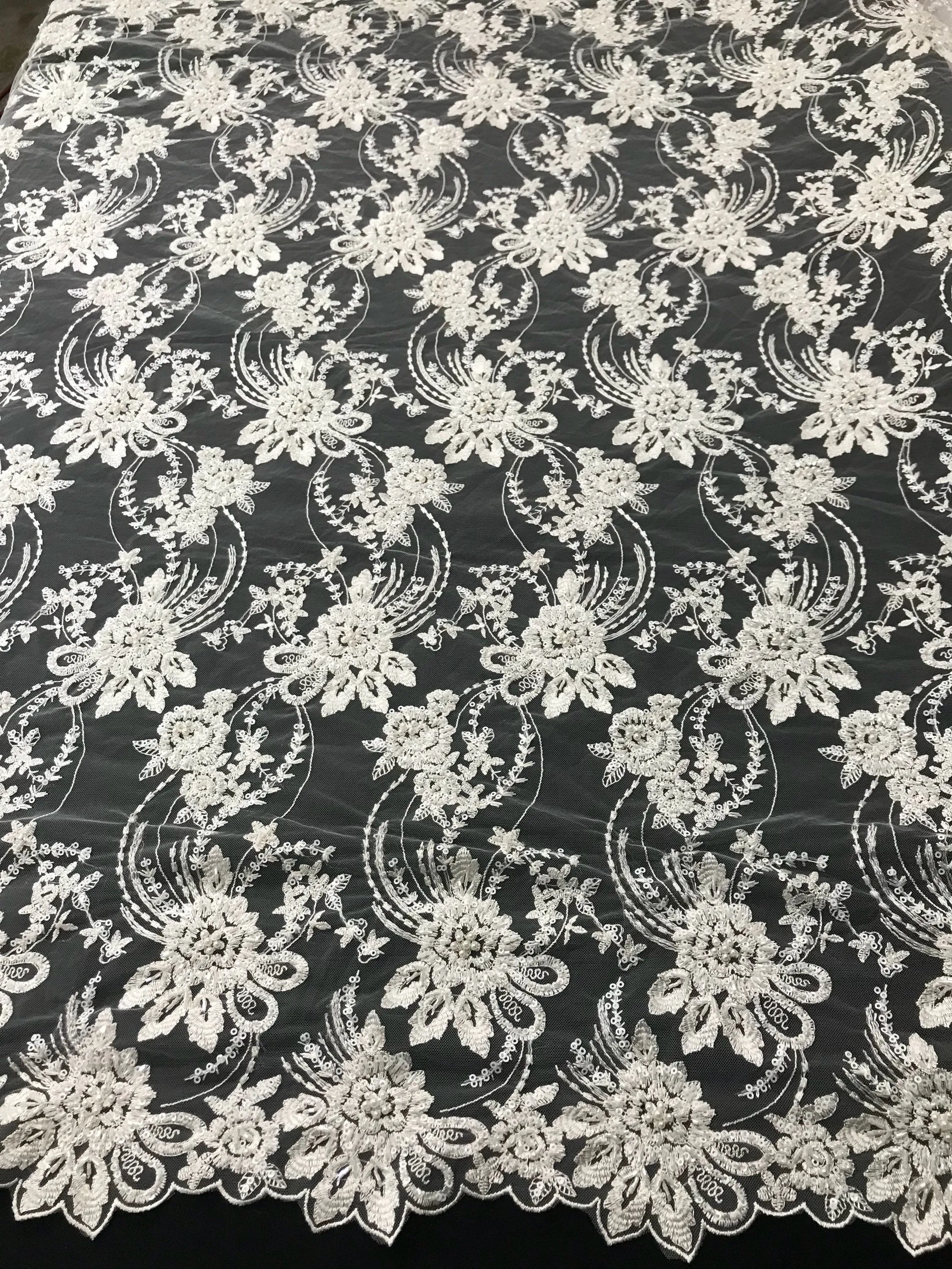 Ivory hand beaded floral design embroider on a mesh lace-dresses-fashion-apparel-wedding-prom-nightgown-decorations-sold by the yard.