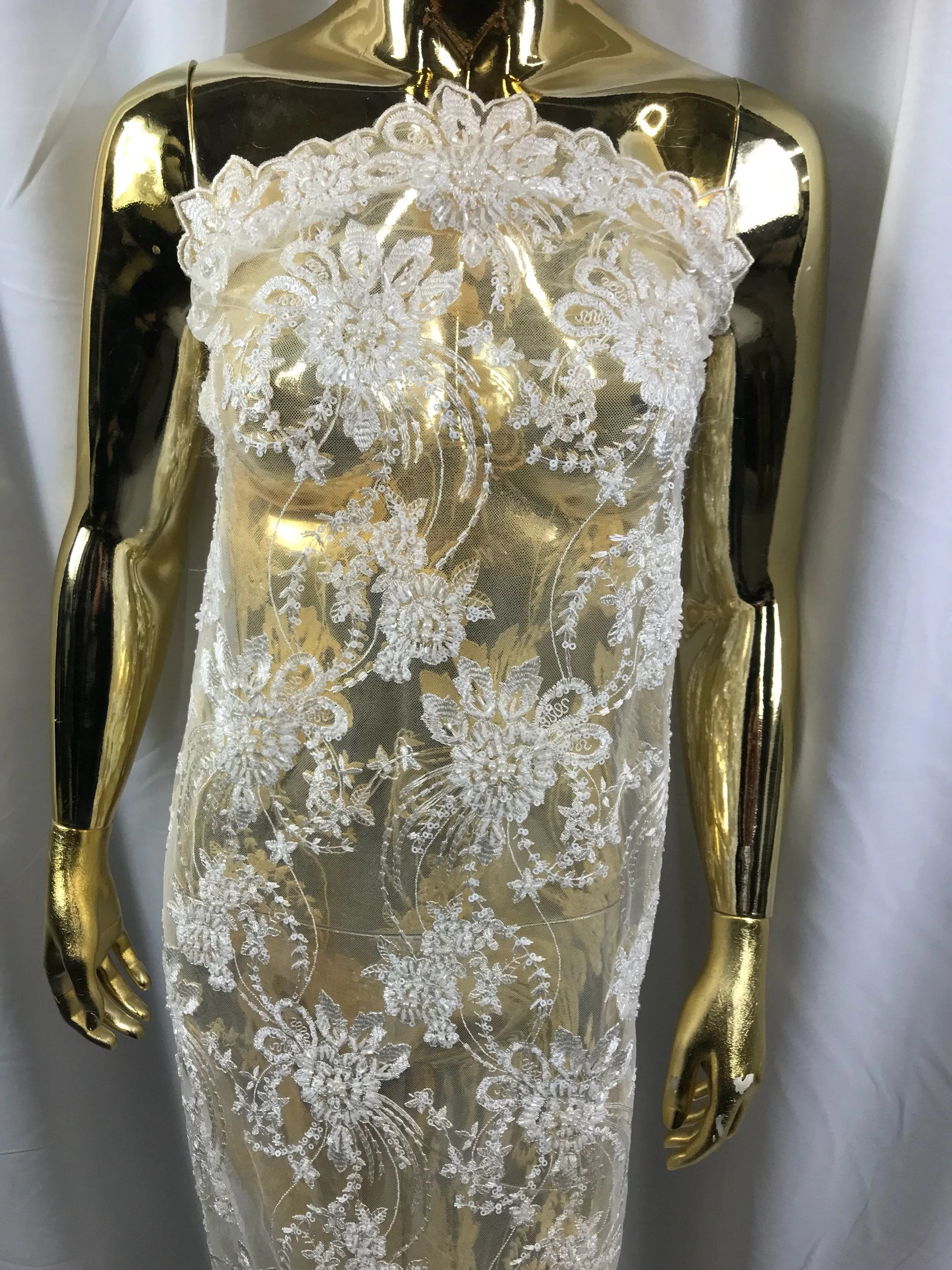 Ivory hand beaded floral design embroider on a mesh lace-dresses-fashion-apparel-wedding-prom-nightgown-decorations-sold by the yard.