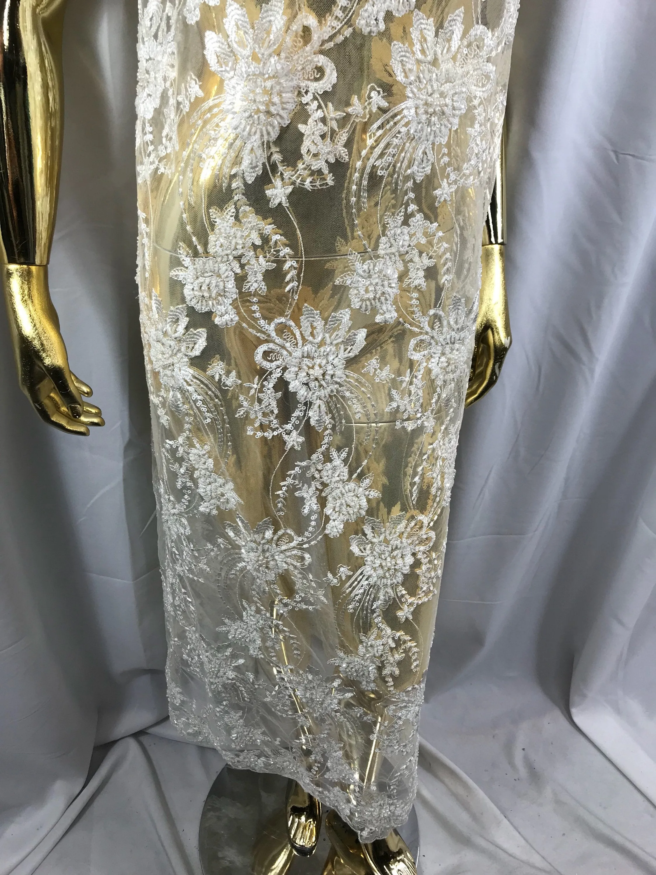 Ivory hand beaded floral design embroider on a mesh lace-dresses-fashion-apparel-wedding-prom-nightgown-decorations-sold by the yard.