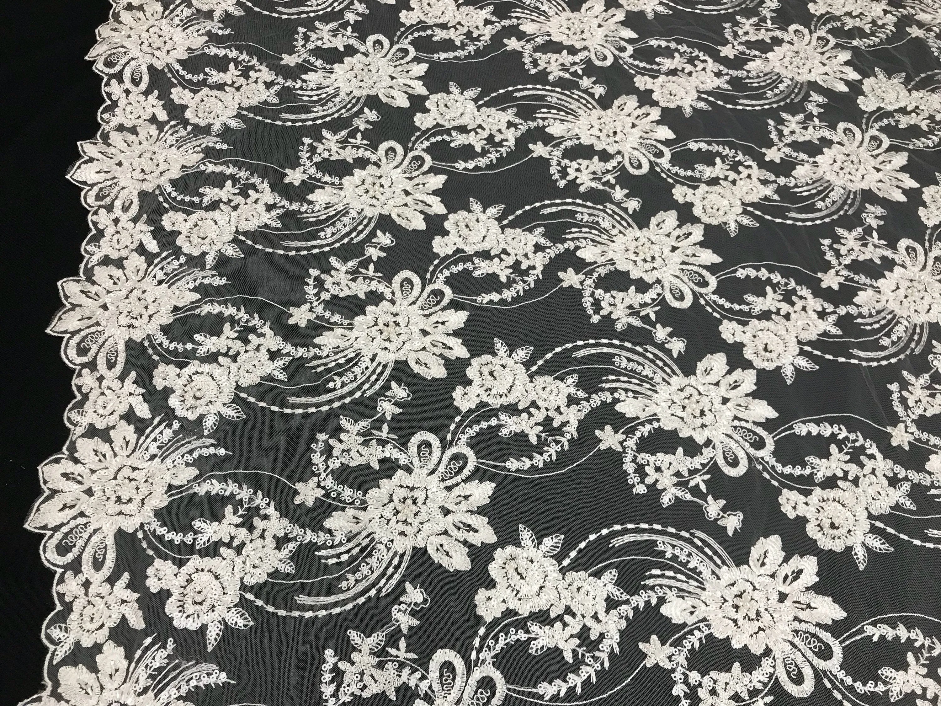 Ivory hand beaded floral design embroider on a mesh lace-dresses-fashion-apparel-wedding-prom-nightgown-decorations-sold by the yard.